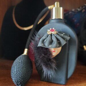 Perfume bottle empty of course Lady's face wearing a hat and mink Art deco